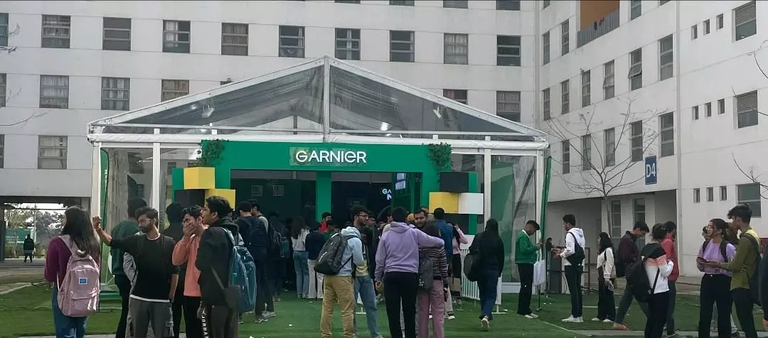 Huge crowd of students outside Garnier Green Science School booth