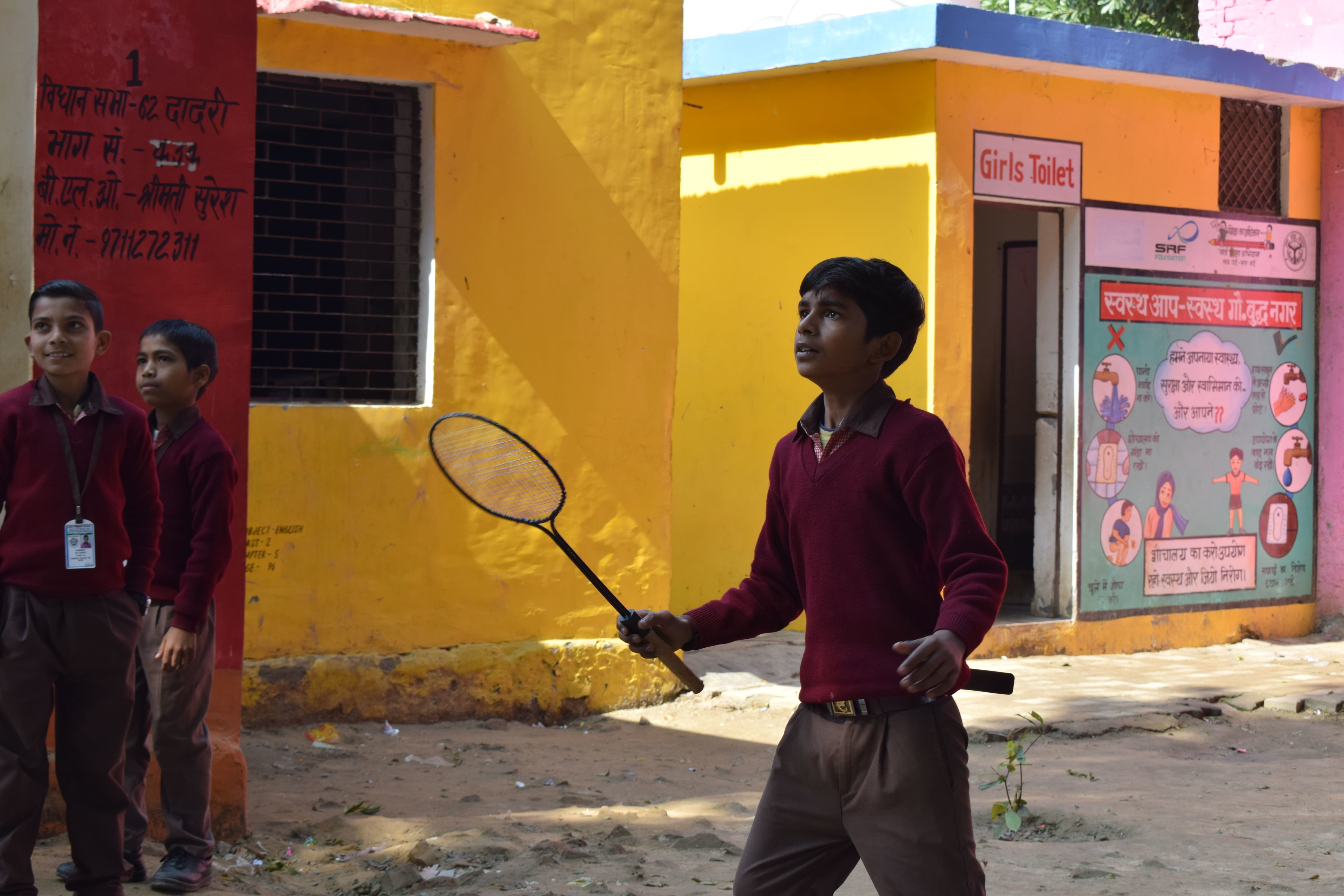 Children playing badminton at the government school in Bhirondi, Greater Noida